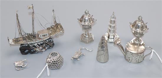 A collection of Chinese novelty white metal items, including a miniature watering can cast with characters,